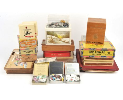 World stamp collection in 19 albums and stock books plus loose in tins, packets with GB First Day Covers, decimal mint issues