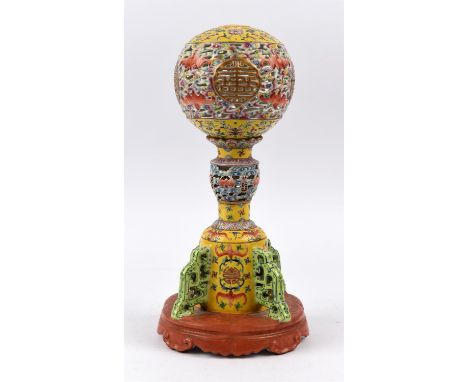 A famille rose cricket cage [or other object]; in two parts decorated with bats and other motifs. The base, 14.5 cm diameter,