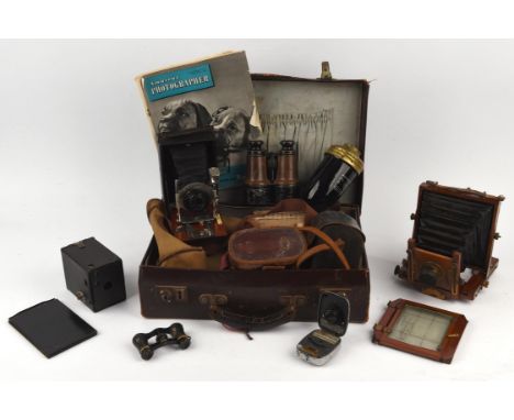 Lukos II folding camera, mahogany and brass quarter plate camera, Army Service field glasses, opera glasses, safety lamp, box