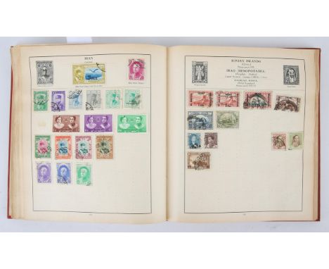 Strand Stamp Album of world stamps with Great Britain 1d black used (cut into) and British Commonwealth.