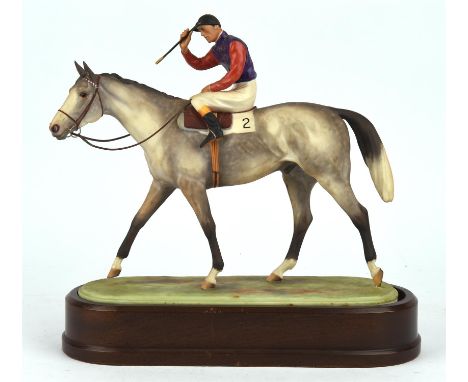 Doris Lindner, a Royal Worcester porcelain model of the Winner, on a wooden stand, 28cm highCondition Report:  There is no ce