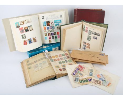 Four Stamp albums with world stamps with Great Britain, British Commonwealth, interesting China with 1897 red revenue 2 cent 