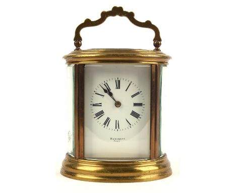 French oval brass and glass carriage clock, the white enamel dial with black Roman numerals signed Margrett, Paris, the movem