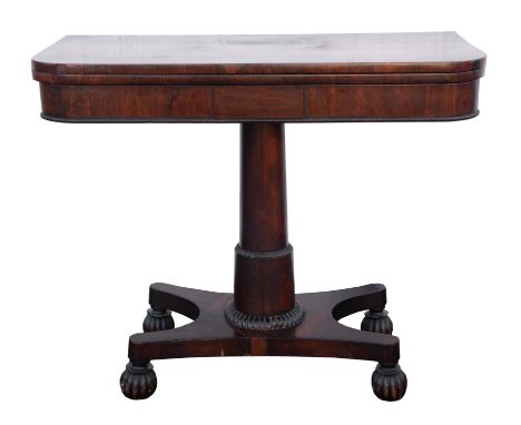 William IV rosewood card table, with swivel top and column stand, quatreform base with reeded bun feet on concealed castors, 