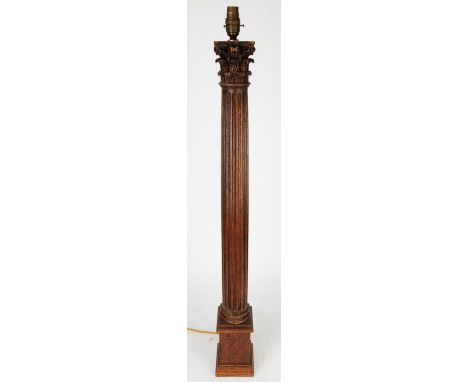 An oak lamp, in the form of a Corinthian column, 19th Century and later, converted to electricity, 92cm high