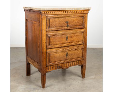 A commode with secretaire finished with marble and made in Louis XVI style. (58 x 76 x 103 cm)