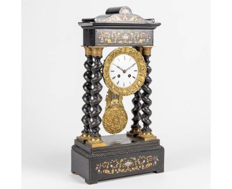 A column table clock with ebonized black wood and marquetry inlay in Napoleon 3 style. The second half of the 19th century. (