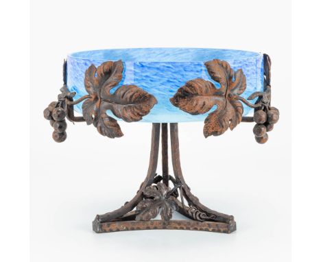 A bowl made of metal and blue glass in art deco. Decorated with grapes and grape vines. The first half of the 20th century. (