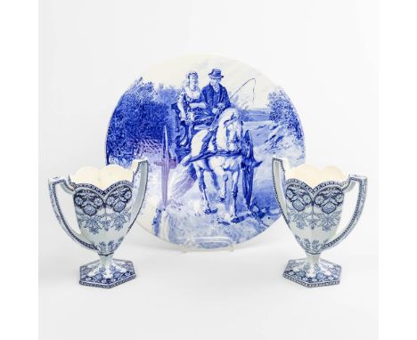 A pair of vases and a plate made of blue-white faience and marked Arras, made in Holland. The plate was made in Delft. (19,5 