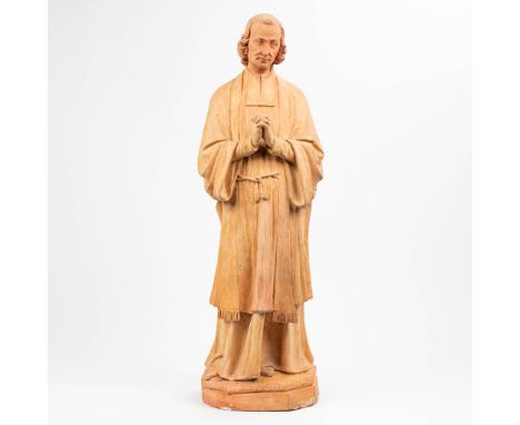 A large statue of a holy figurine of Jean-Marie Vianney (1786-1859) made of terracotta. The first half of the 20th century. (