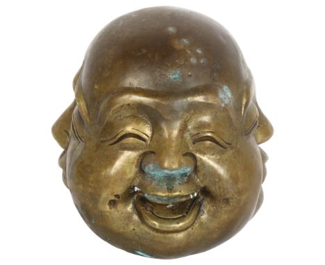 A 20th century Japanese bronze paperweight, showing 4 faces of Buddha, with seal mark to the base, height 12cm 