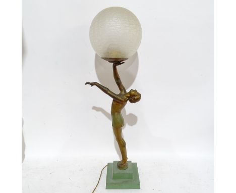 An Art Deco gilded spelter figure holding a globular glass light shade on stepped plinth, height 62cm overall (A/F)