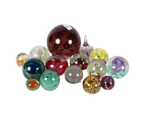 A collection of paperweights including 3 Caithness and a Mdina, tallest 15cm 