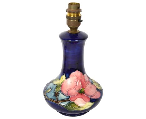 MOORCROFT - a tube-lined Hibiscus decorated table lamp, height to top of bayonet fitting 25cmLamp is in good overall conditio