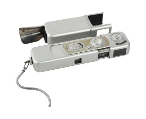 A Minox Complan :3-5 15mm camera with chain, and a C4 cube flash adapter, both cased 