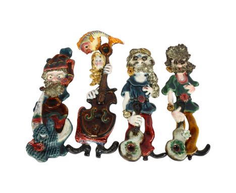 A set of 4 Licinio painted ceramic wall sculptures, 37cm approx, and a fish plaque 