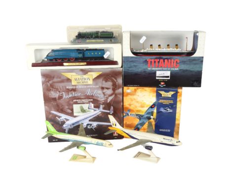 A quantity of boxed Vintage toys, including a 1/1136 scale model of the Titanic by Playtown, a Corgi Supermarine Spitfire Mk 