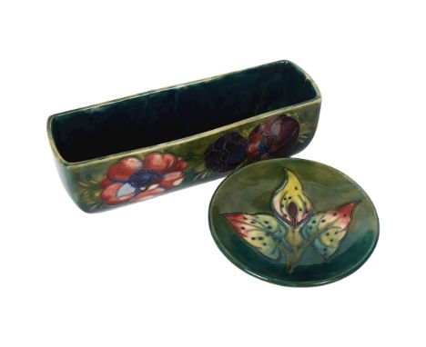 MOORCROFT - a small tube-lined Orchid decorated dish, diameter 12cm, and a tube-lined Anemone decorated small flower trough, 