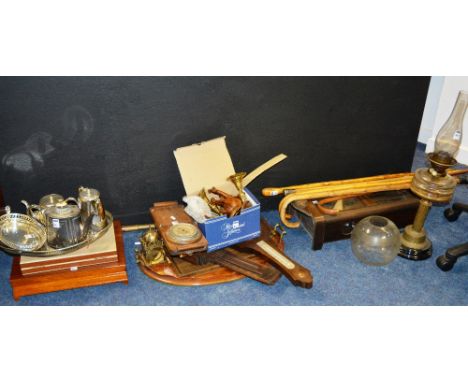 A large quantity of sundry items to include walking sticks, barometers, wall clock, oil lamp, plated wares and brasswares (a 