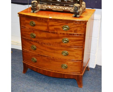 A George IV style mahogany chest of drawers, with two short over three long drawers, raised on bracket supports, 81cm high x 