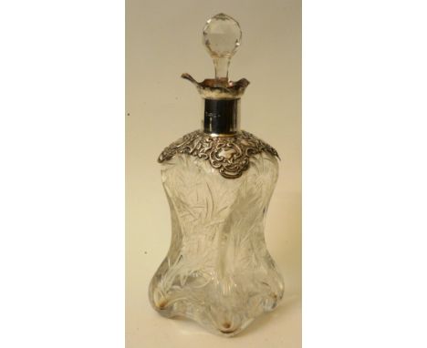 An Edward VII silver collared decanter, Chester 1902, John & William Deakin, with shaped lip and spout over scrolling bird an