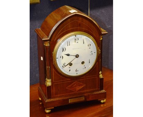 An Edwardian mahogany inlaid bracket clock, by Brierley Wood & Co Glasgow, with white enamel circular dial, Arabic numerals a