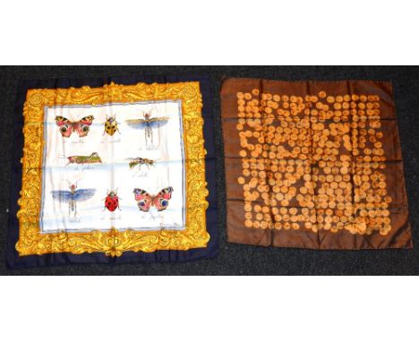 A Christian Dior silk scarf, depicting insects on navy, white and gold ground, 85 x 87cm, together with another Christian Dio
