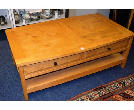 A modern light oak coffee table, with fitted drawers, 46cm high x 120cm wide