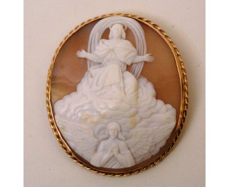 A large yellow metal cameo, depicting the Lord and angel within the heavens, 6 x 5cm CONDITION REPORT: Lot 56 - Overall good 
