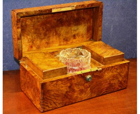A 19th century burr walnut tea caddy, the hinged lid enclosing two fitted tea compartments and mixing glass, 18cm high x 33cm