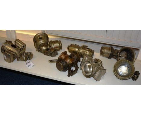 Four vintage bicycle lamps, named to Jos Lucas Ltd, Birmingham, one other stamped Powell & Hammer Ltd, Birmingham, and anothe