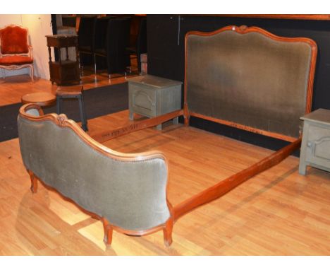 A French light wood framed double bed, the ends upholstered in green velour, with side rails, 6.7ft long x 4.5ft wide