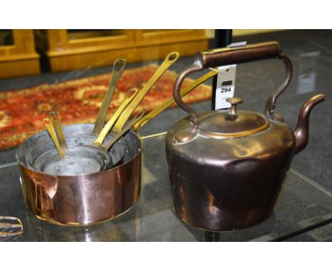 A quantity of vintage copper graduated pots, with brass handles, together with a copper kettle (a lot)
