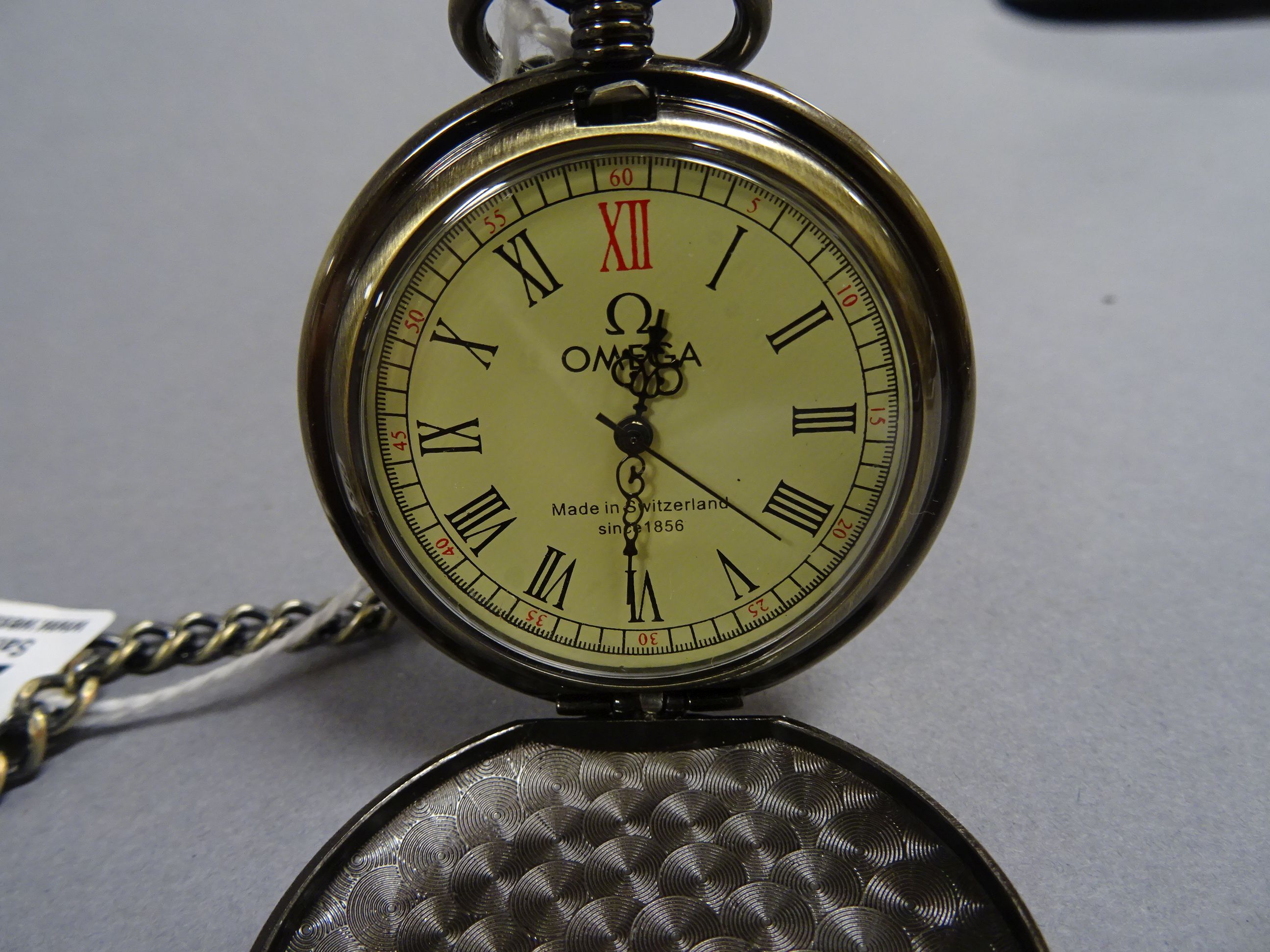 Pocket watch with medieval scene to front