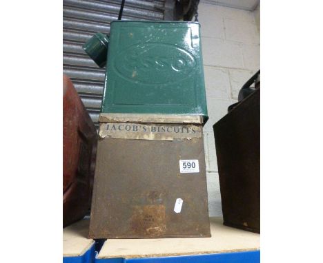 A vintage Esso petrol and oil can, along with a Jacob's biscuits tin