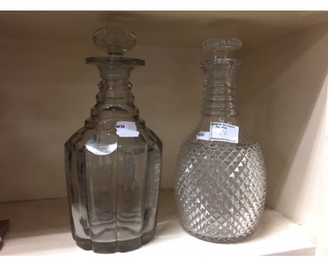 Two 19th century glass decanters, to include an Irish diamond cut example and along with a heavy pillar decanter and stopper
