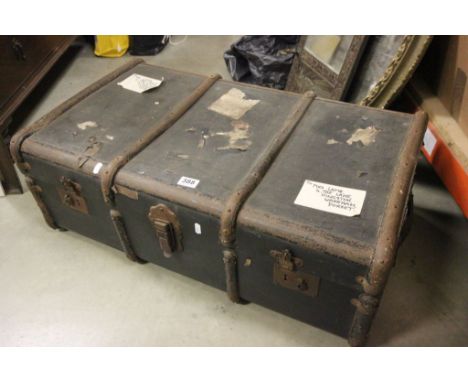 A large trunk, along with medicine cabinet and a brush set 
