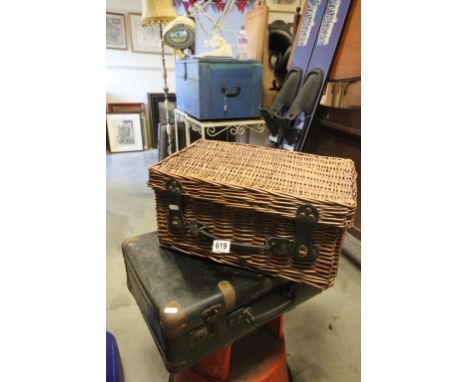 Wicker picnic hamper lacking contents and a vintage suitcase
