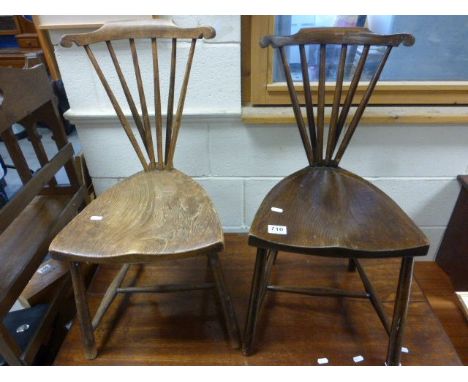 A pair of V Shaped  oak and walnut stick back chairs 