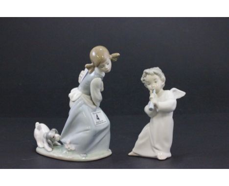 A Lladro figure of a girl and puppy, along with a Lladro figure of an angel playing a musical instrument 