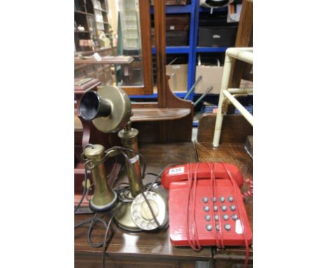 Mid 20th Century Centenary of the telephone stick phone and a red push button phone