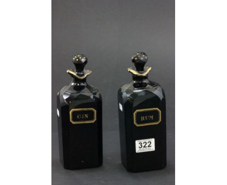 A pair of early 19th century decanter with a gilded decoration "Gin" & "Rum"