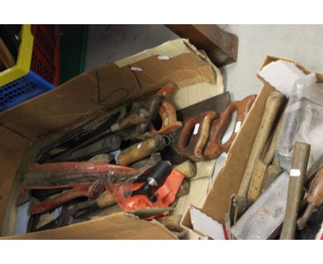 A collection of vintage tools including saws, vices and others 
