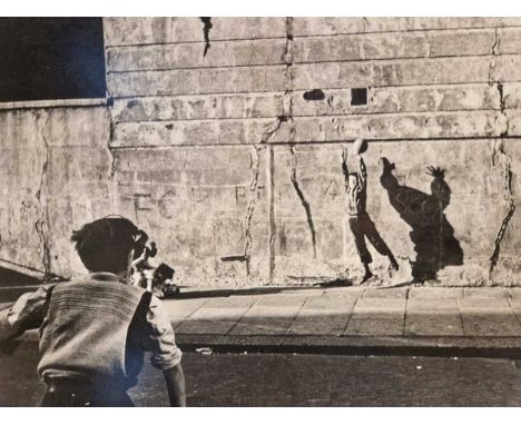 Roger Mayne (1929-2014) a silver gelatin photographic print of children playing in the street, signed and dated 87 and 56, un