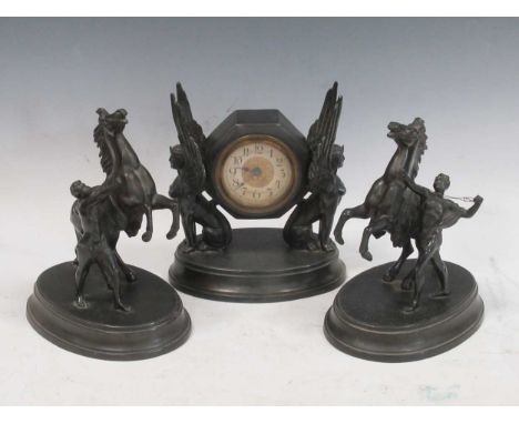 A bronzed clock garniture, the clock flanked by a pair of Marley horses