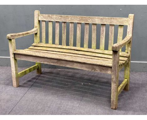 A modern teak garden bench with slatted seat and stick back 83 x 122 x 60cmProvenance: Heydon Grange, Norfolk