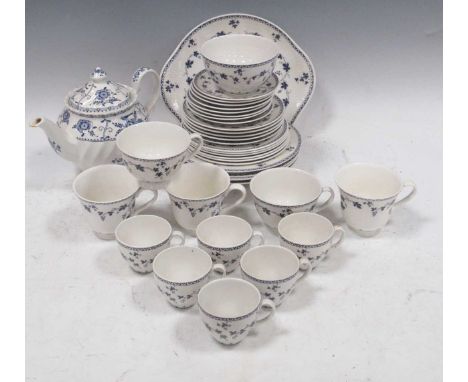 A part blue and white Royal Doulton tea service, Yorktown pattern, decorated with trailing grape vines, and a teapot of a sim