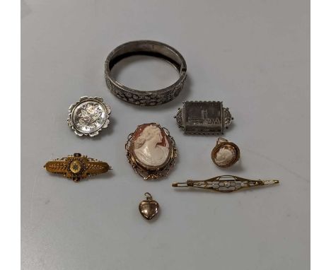 A cameo brooch marked 9ct, a cameo ring, a heart shaped pendant marked 9ct, a pearl brooch, a diamond set brooch marked 15ct,