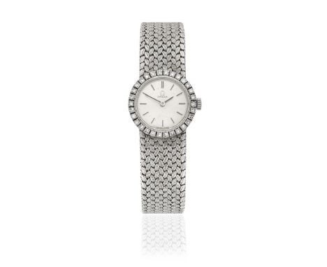 Omega. A lady's 18K white gold diamond set manual wind bracelet watchReference: 7168Date: London Import mark for 1966Movement