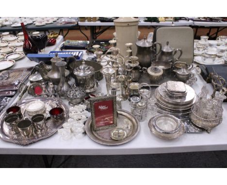 A VERY LARGE QUANTITY OF SILVER PLATE ITEMS TO INCLUDE COFFEEPOTS, CRUET SETS, COASTERS, TRAYS, PICTURE FRAMES, ETC.,